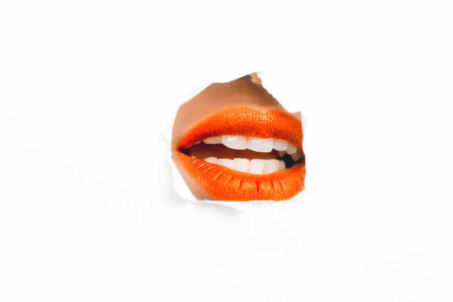 photography of woman s orange lip